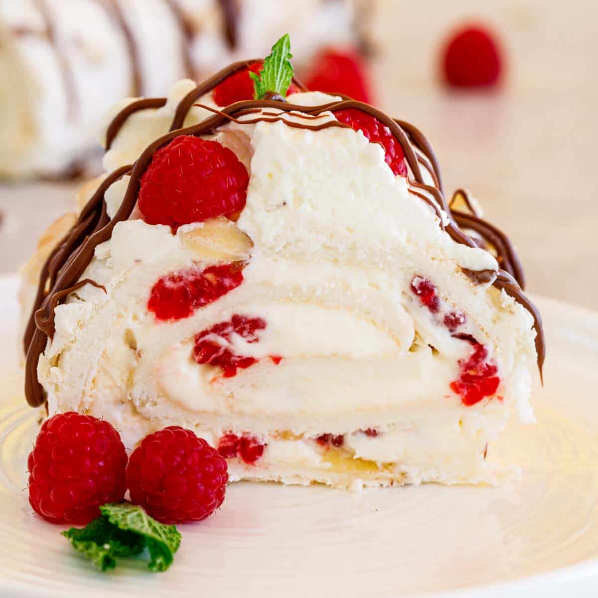 The berry roulade sliced in half to show the layers. 