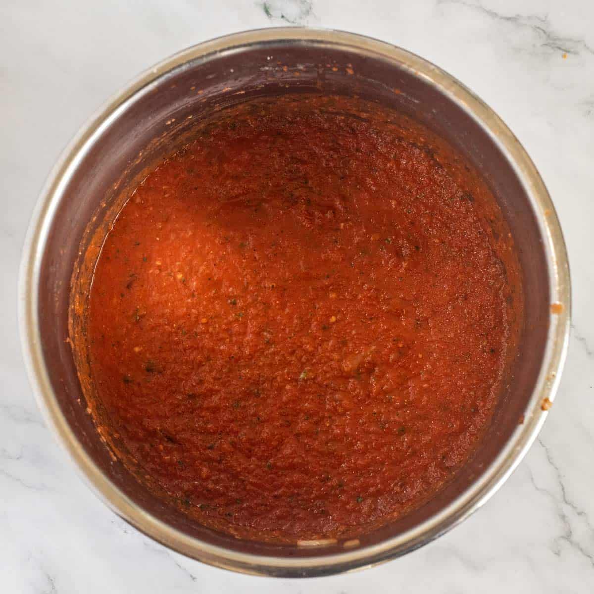 An instant pot of the marinara sauce. 