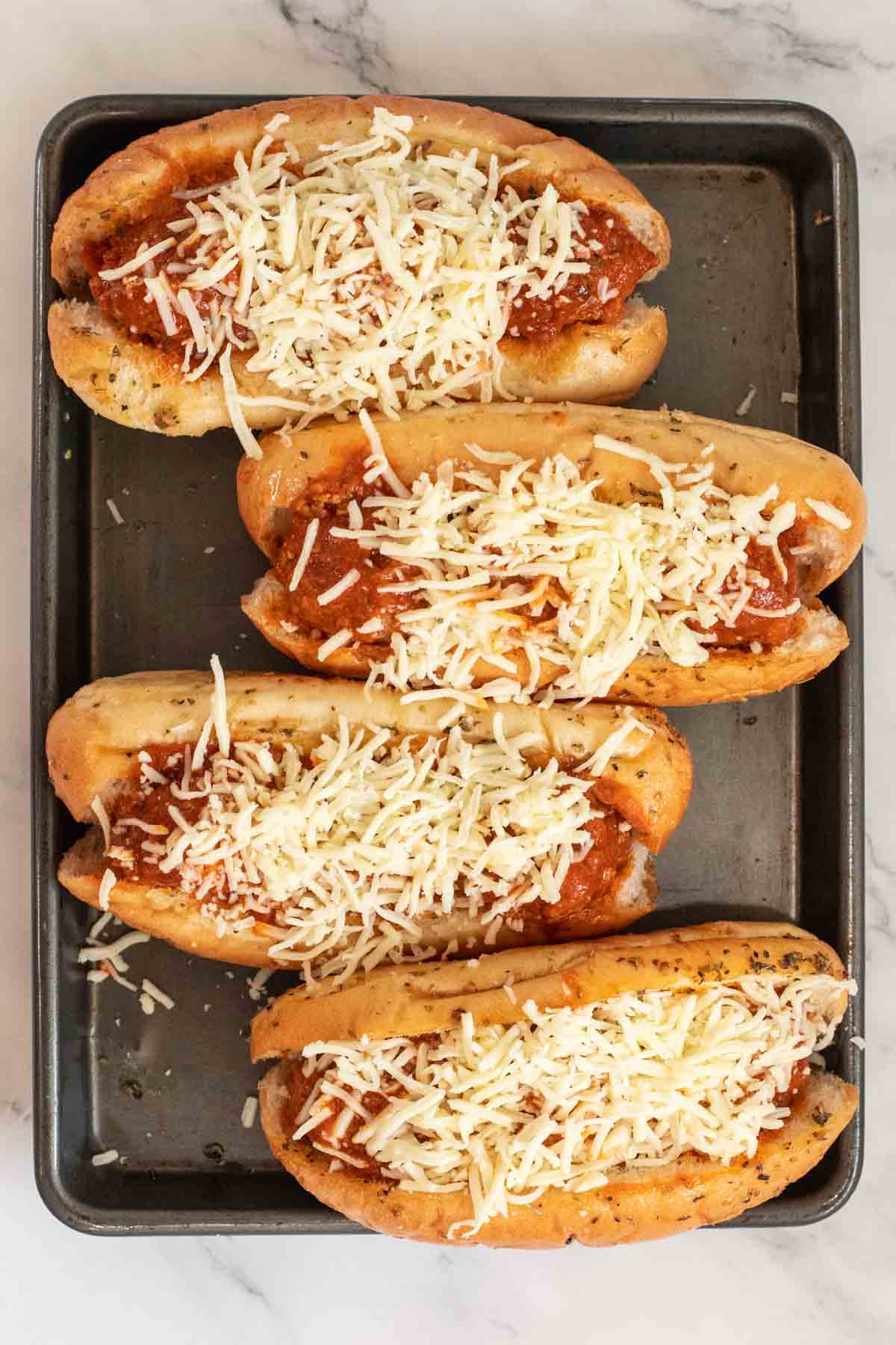 The meatball subs topped with cheese. 