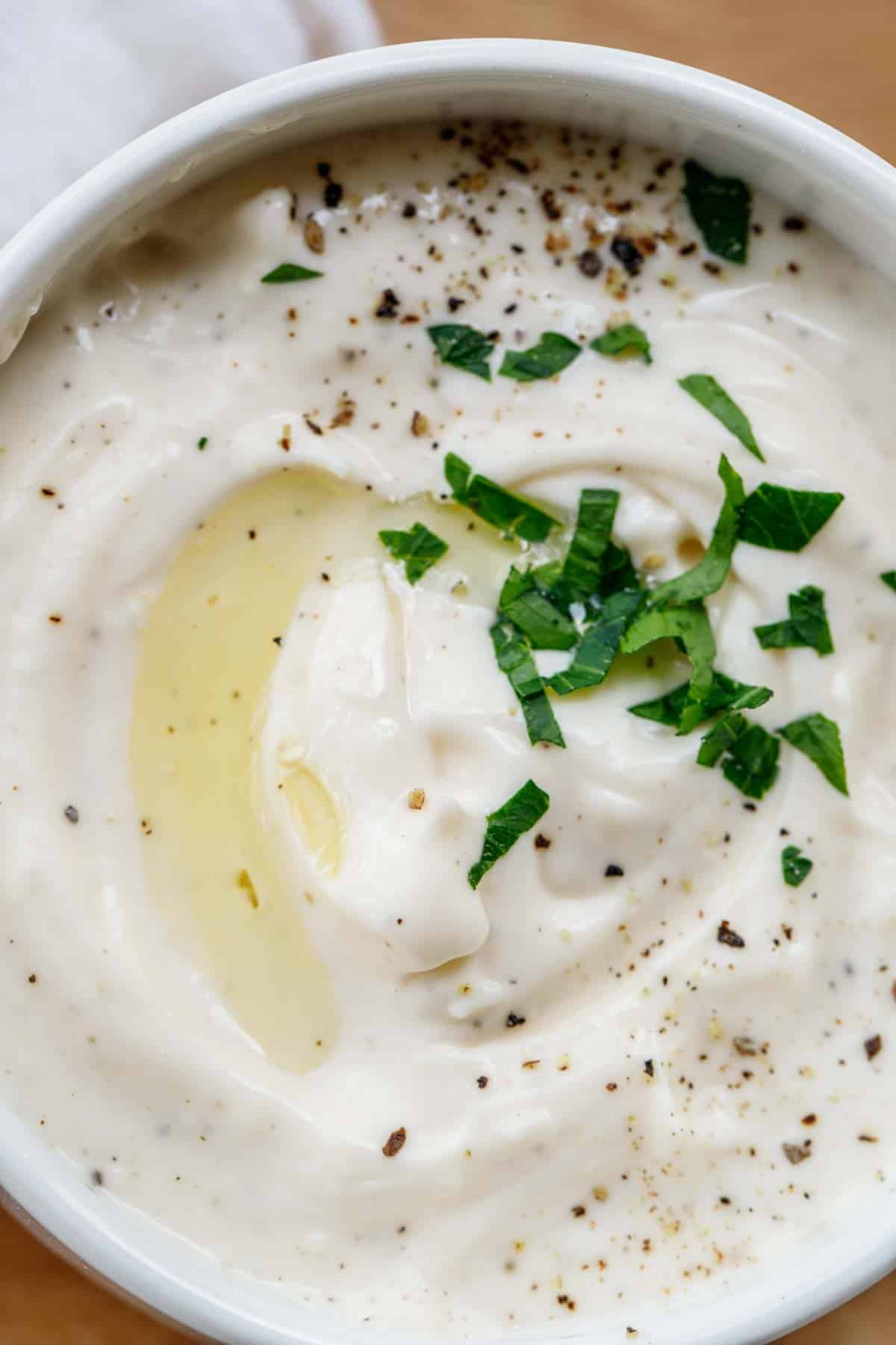 The combined aioli ingredients in a white bowl. 