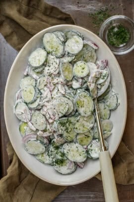 A salad bowl with creamy cucumber salad.