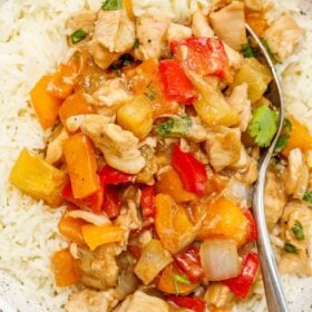 A bowl of white rice, topped with a hawaiiasn chicken mix.