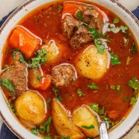 A dutch oven with the cooked beef stew.