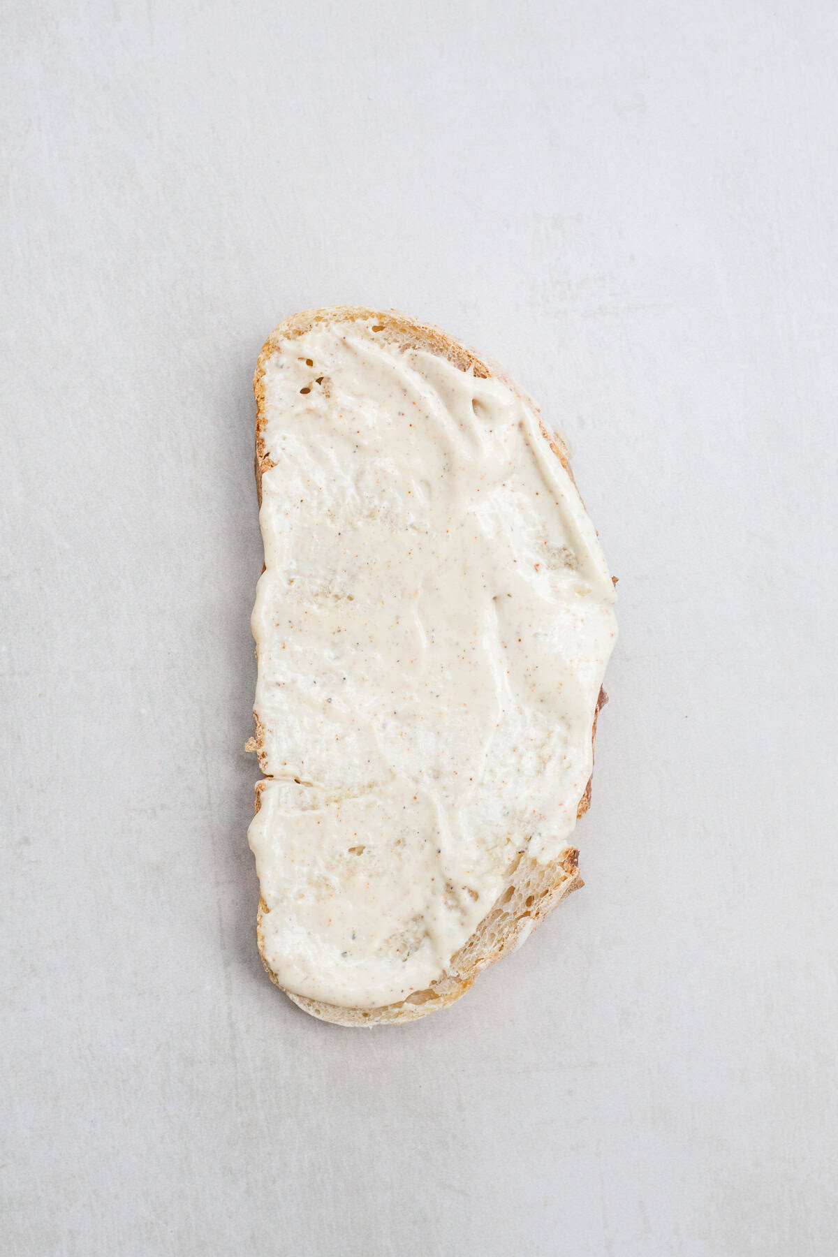 This easy turkey sandwich recipe makes the perfect flavorful turkey sandwich. A sourdough bread slice, topped with a homemade sandwich spread.