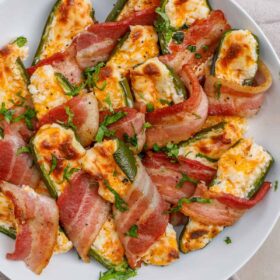 A plate of bacon wrapped jalapeno poppers.