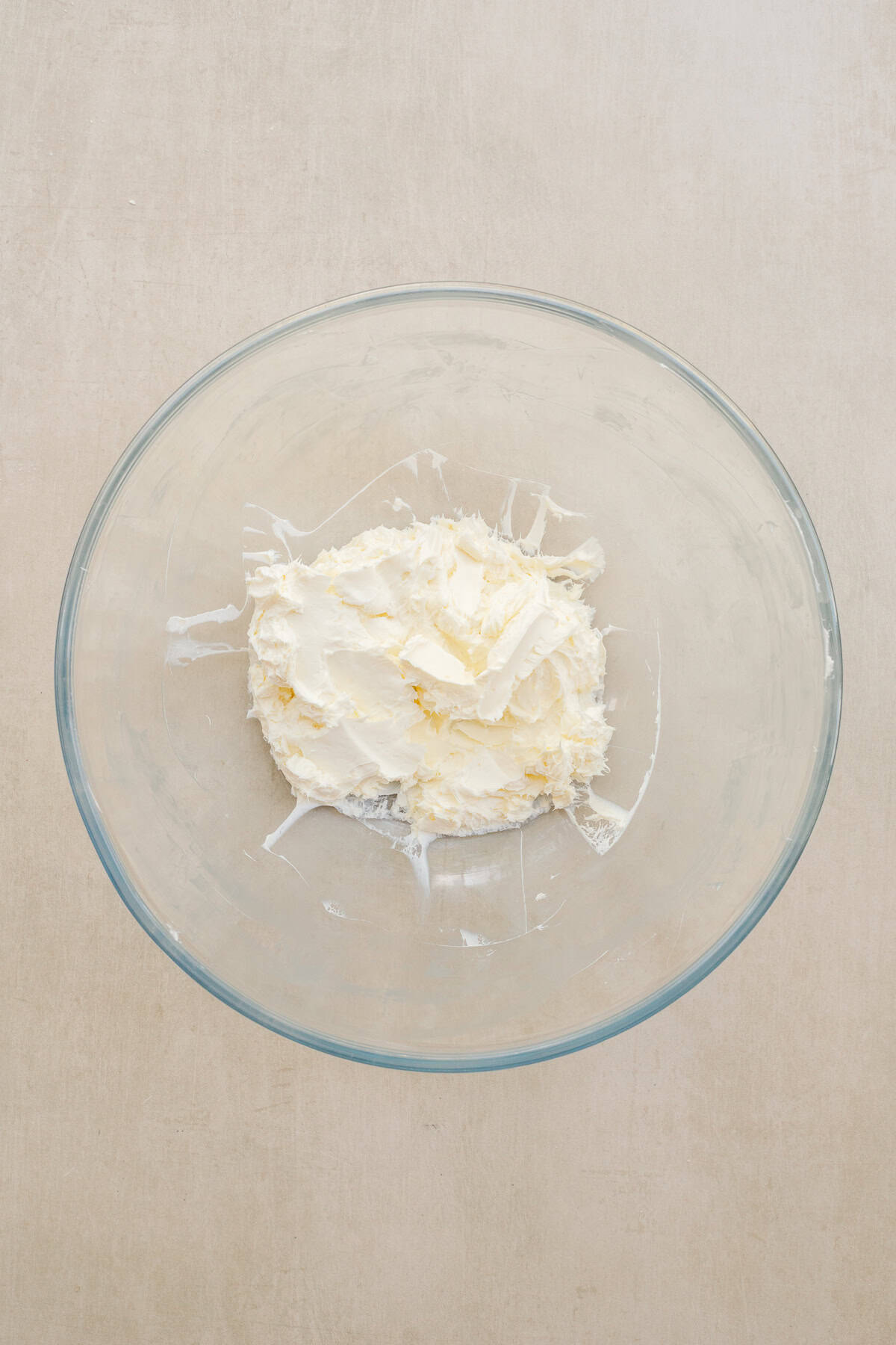 Homemade dubai chocolate cream horns make the perfect christmas dessert. A glass bowl with the cream cheese.