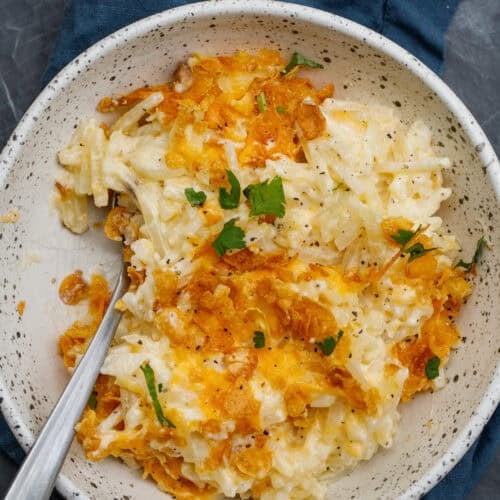 A bowl of hash brown casserole.