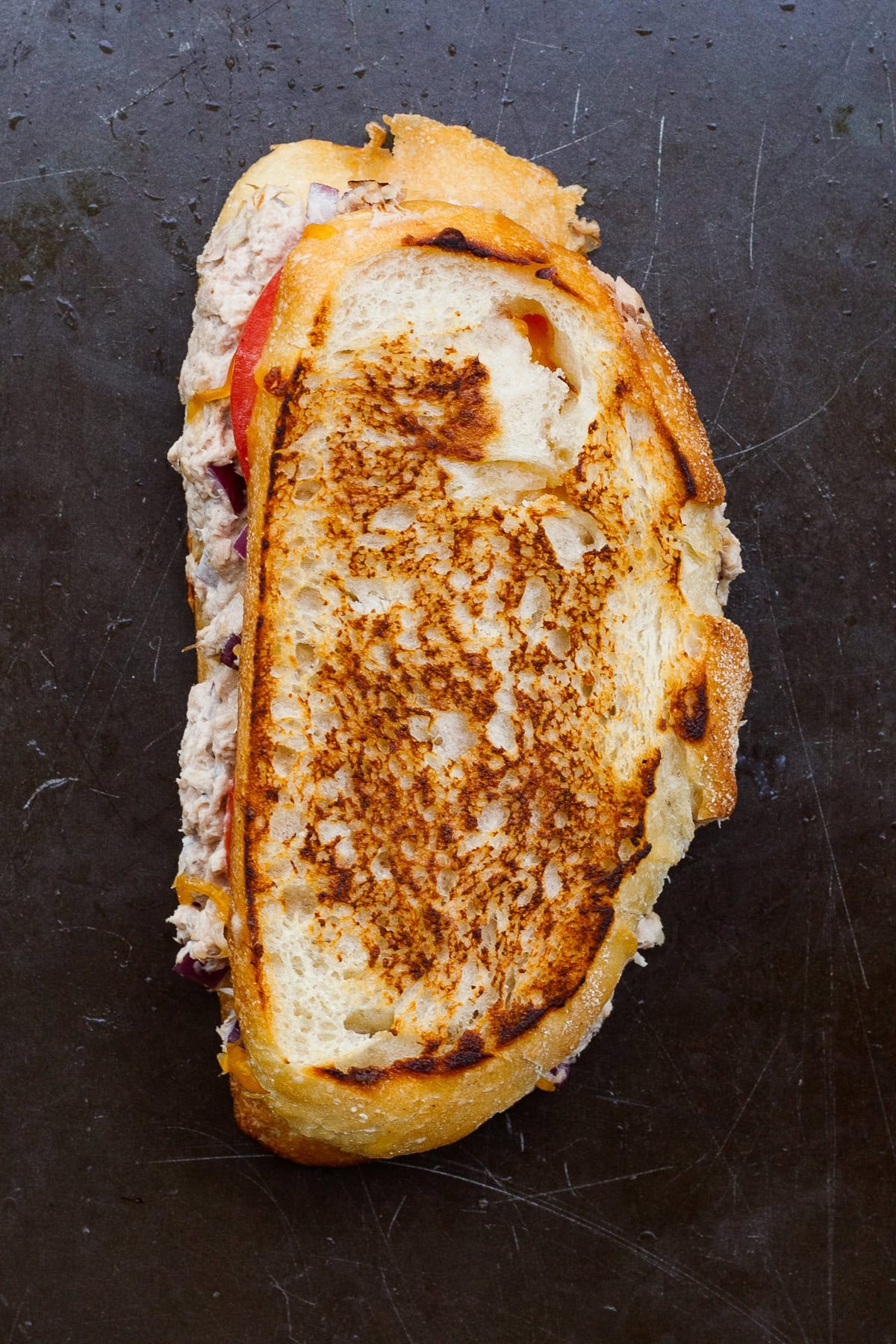 A simple and classic tuna melt sandwich recipe. A golden brown tuna sandwich.