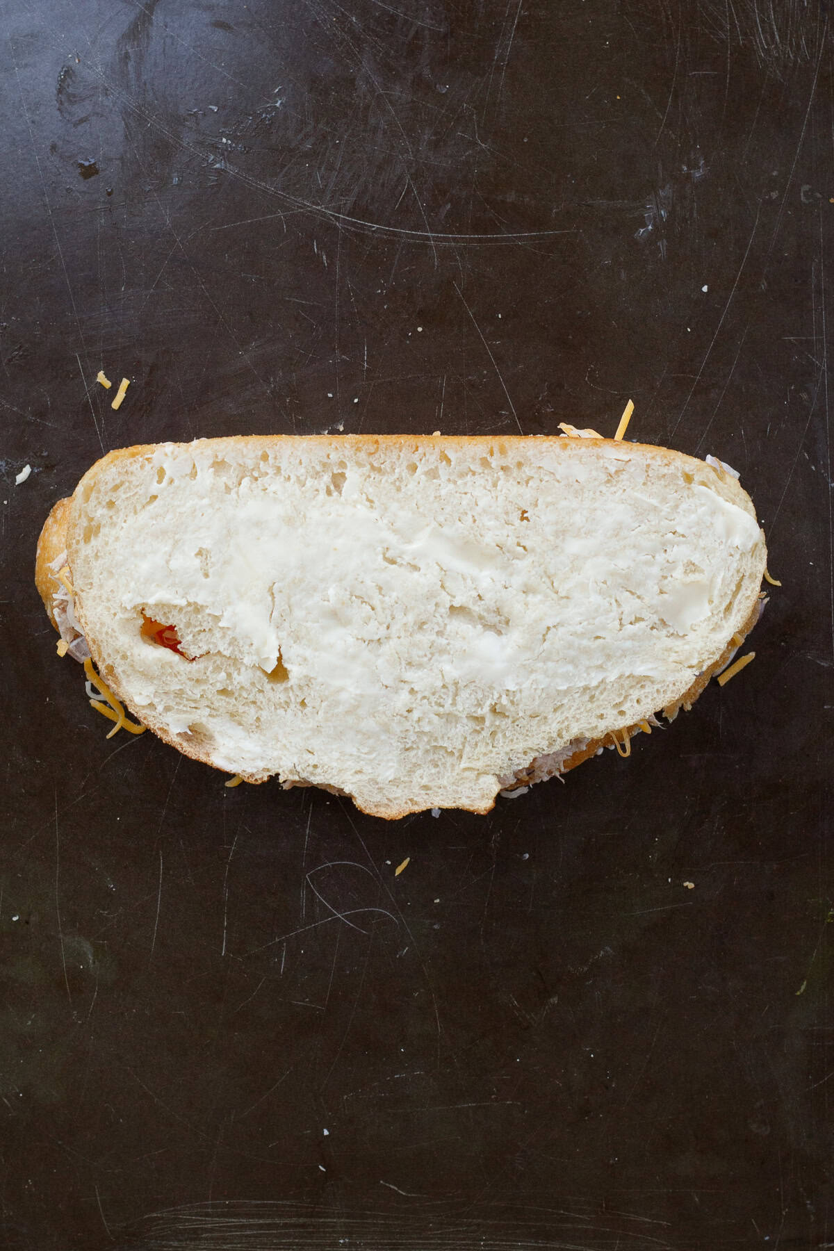 A crispy and cheesy tuna melt sandwich makes the perfect lunch. The tuna melt sandwich with a layer of mayo on the outside of the bread.