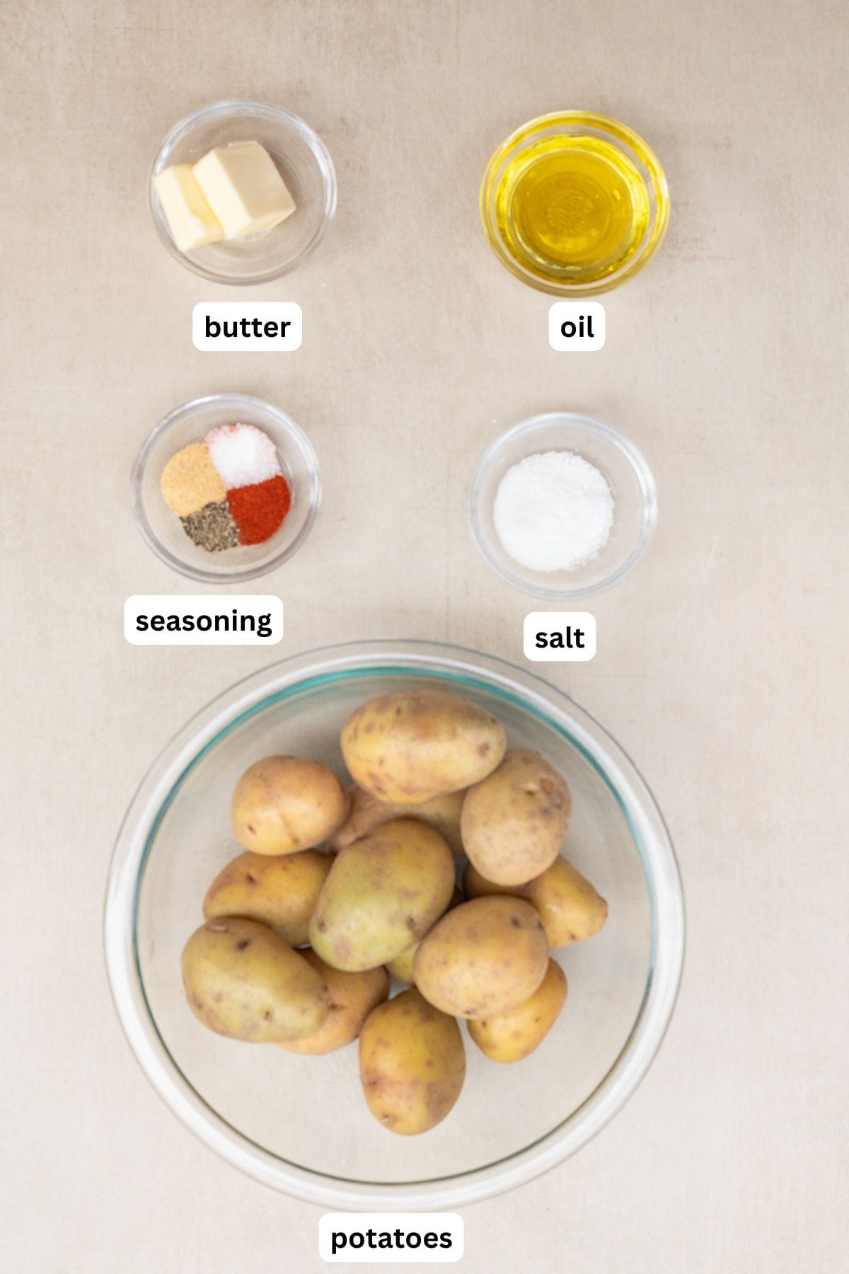 Best Smashed Potato Recipe with Yukon Gold potatoes. All of the ingredients for smashed potatoes labeled.