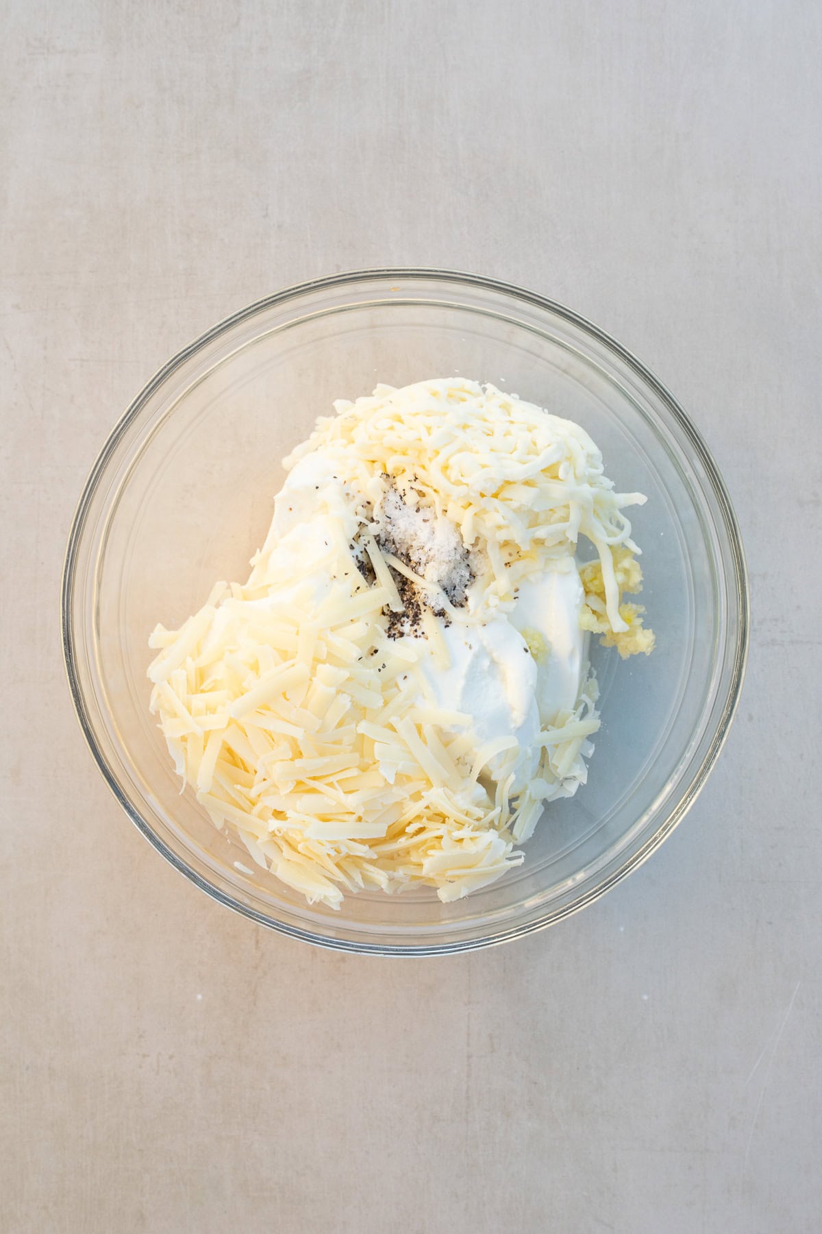 A roasted cheese dip makes the perfect easy appetizer. A bowl with the ricotta dip ingredients.