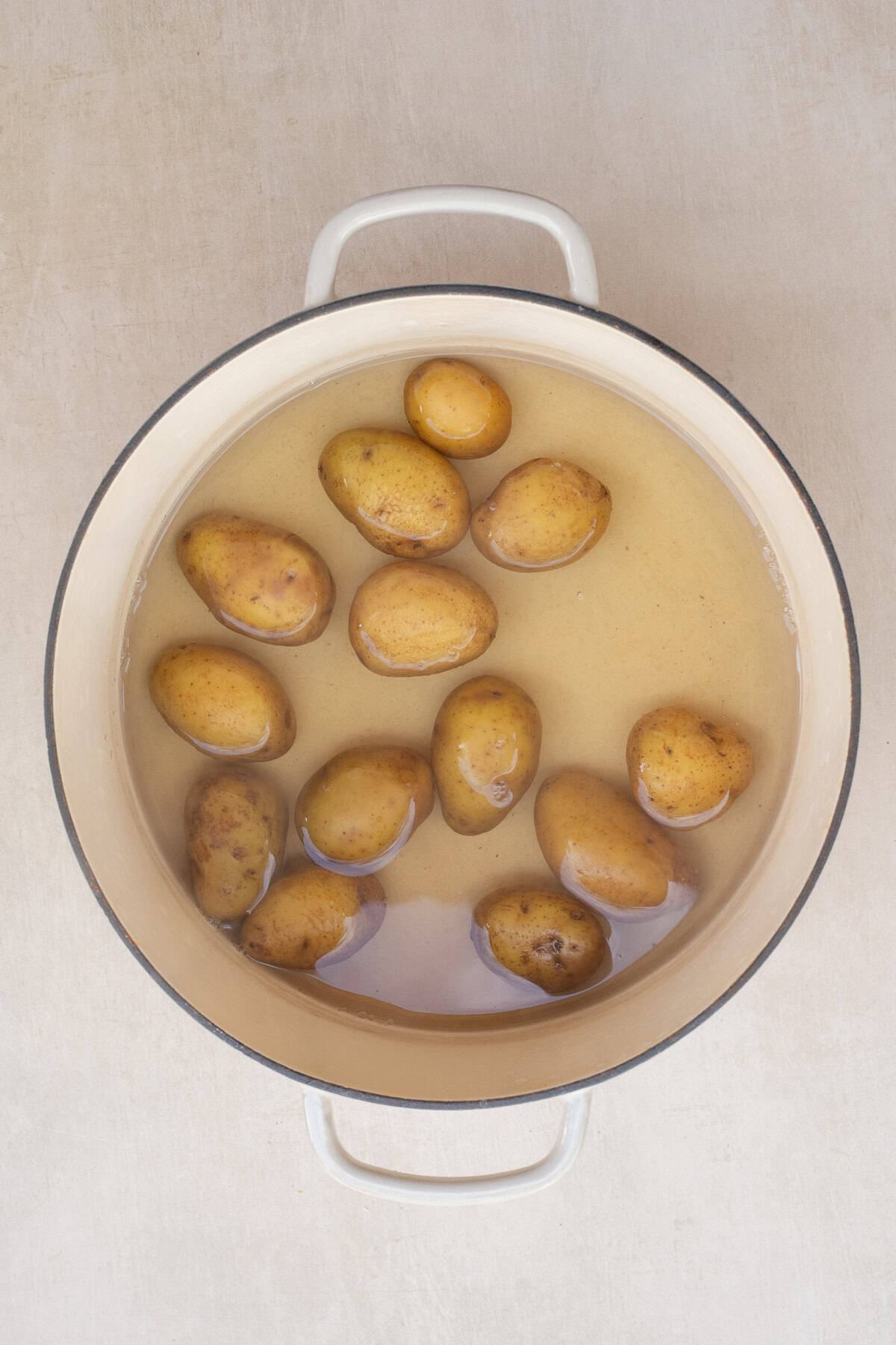 Easy Smashed Potato Recipe (Super Crispy!) A pot with the salted water and potatoes.