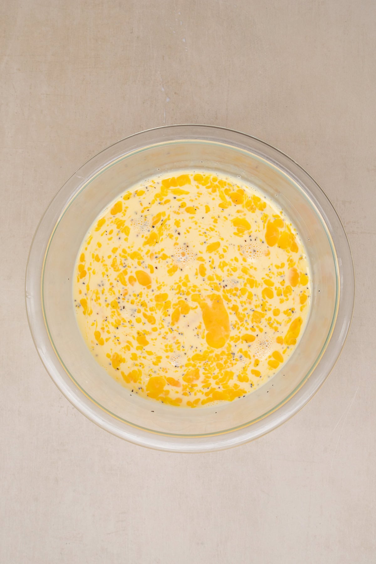 A buttery pie crust is loaded with a delicious egg filling. A bowl with the egg custard.