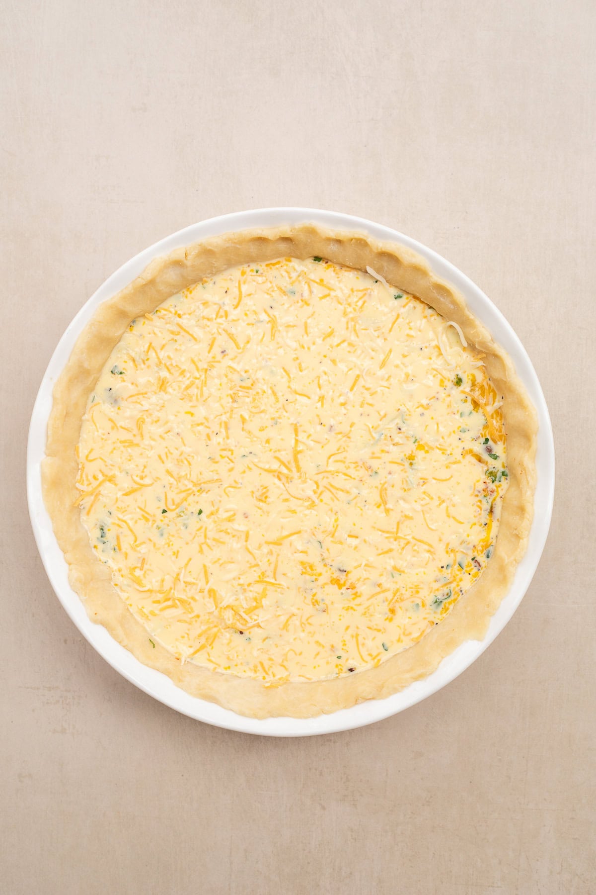 This quiche is loaded with a cheesy egg filling and baked to golden perfection. The pie crust with the savory egg custard.
