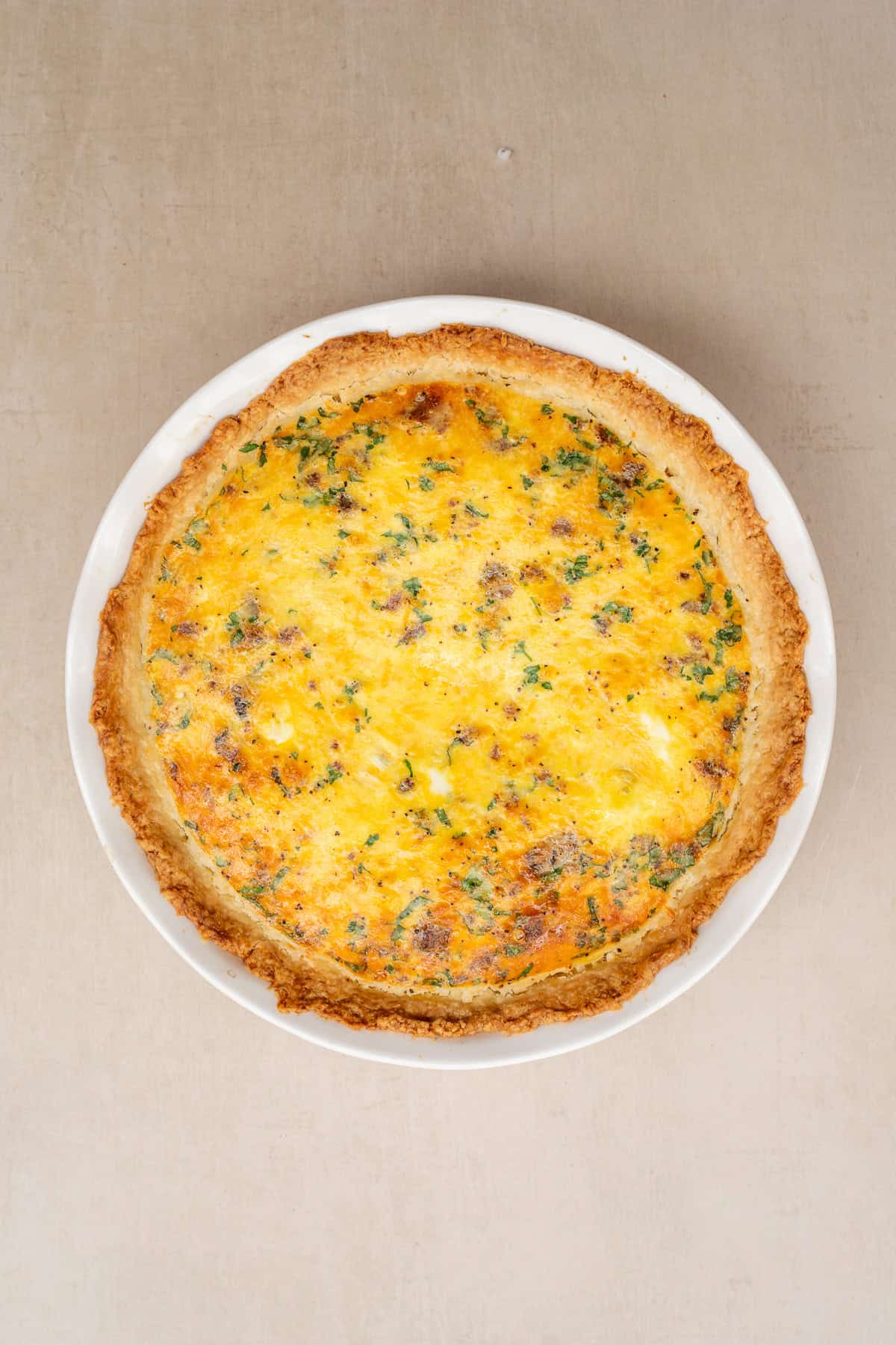 This easy quiche recipe makes the perfect savory breakfast thats fit to serve a crowd. The baked quiche set and out of the oven.