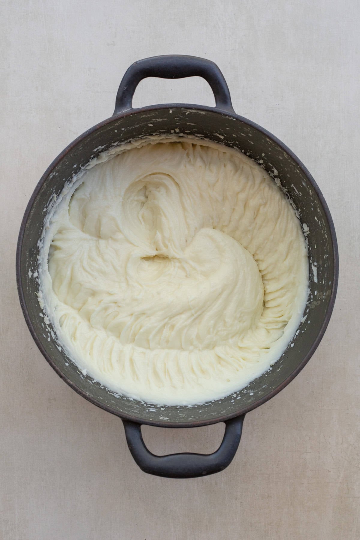 Heavy cream mashed potatoes make the perfect potato side dish. The potatoes are light, fluffy, and super creamy. A pot of the creamy mashed potatoes, beaten with cream.