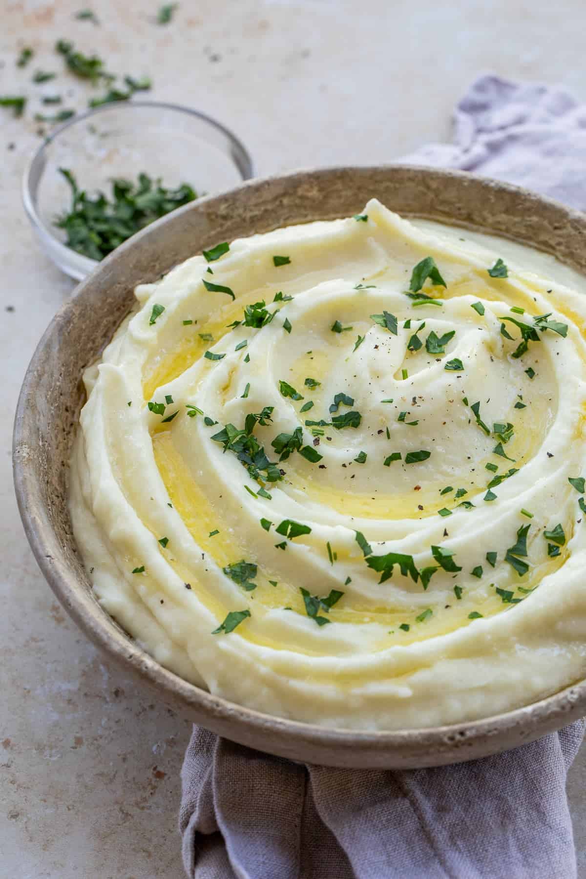 Easy and delicious heavy cream mashed potatoes make the best side dish recipe. A bowl of creamy mashed potatoes, topped with fresh herbs.