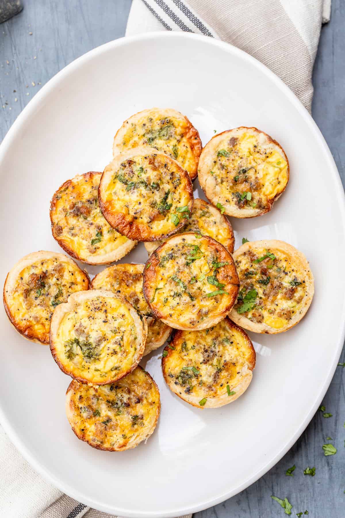 Crowd-Pleasing Mini Quiche Appetizer Recipe A plate of mini quiches.