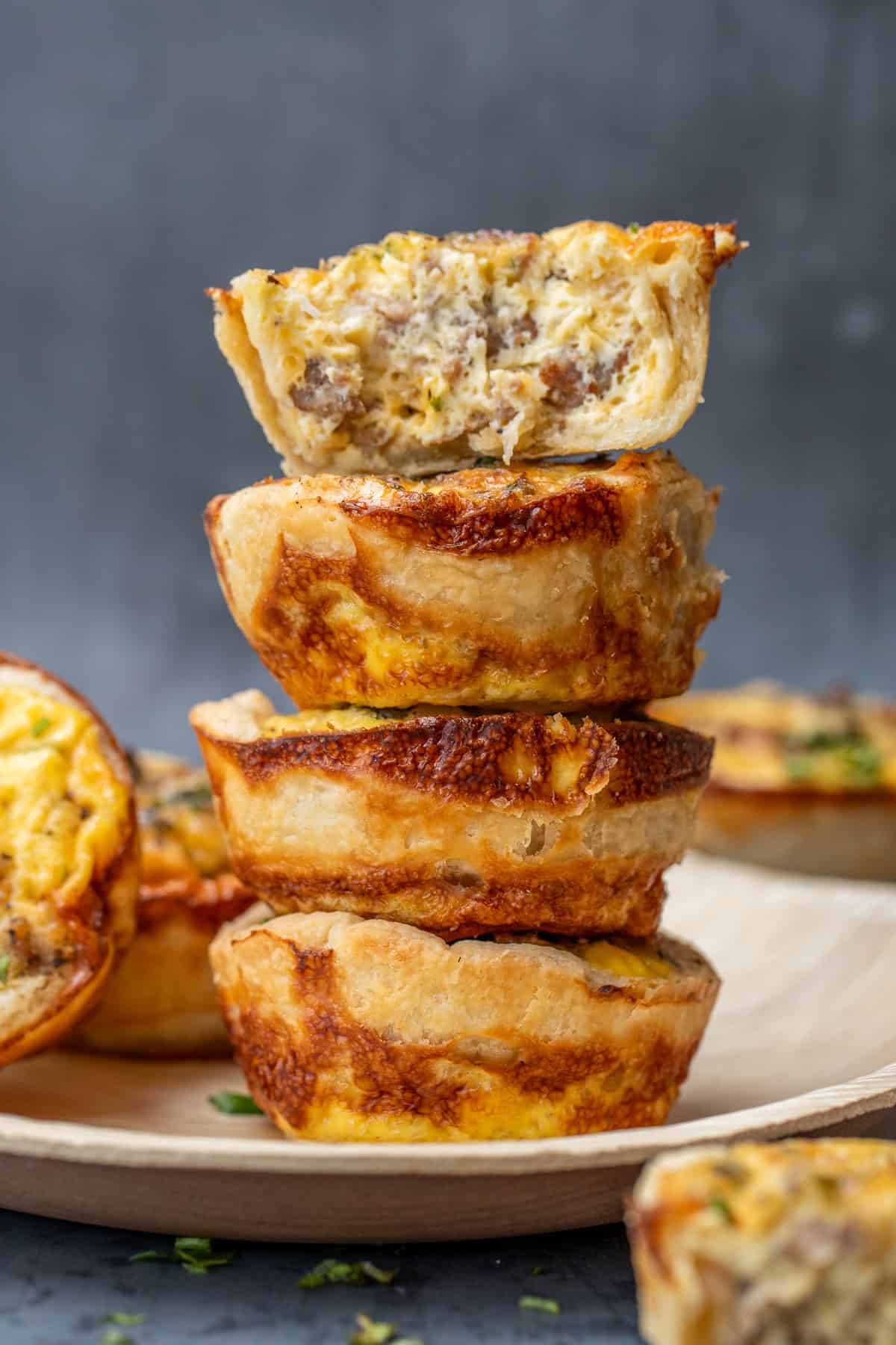 Mini Quiche Recipe, perfect for a Brunch Spread Mini quiches stacked on top of each other.