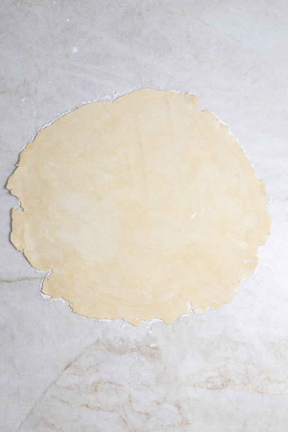 Quick and Easy Mini Quiche Recipe A rolled out pie crust.