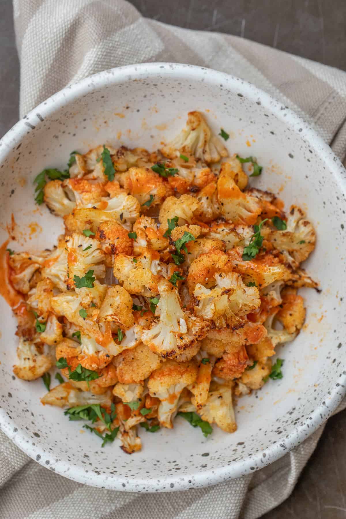 Best Way to Cook Cauliflower in Air Fryer A bowl of crispy air fryer cauliflower.