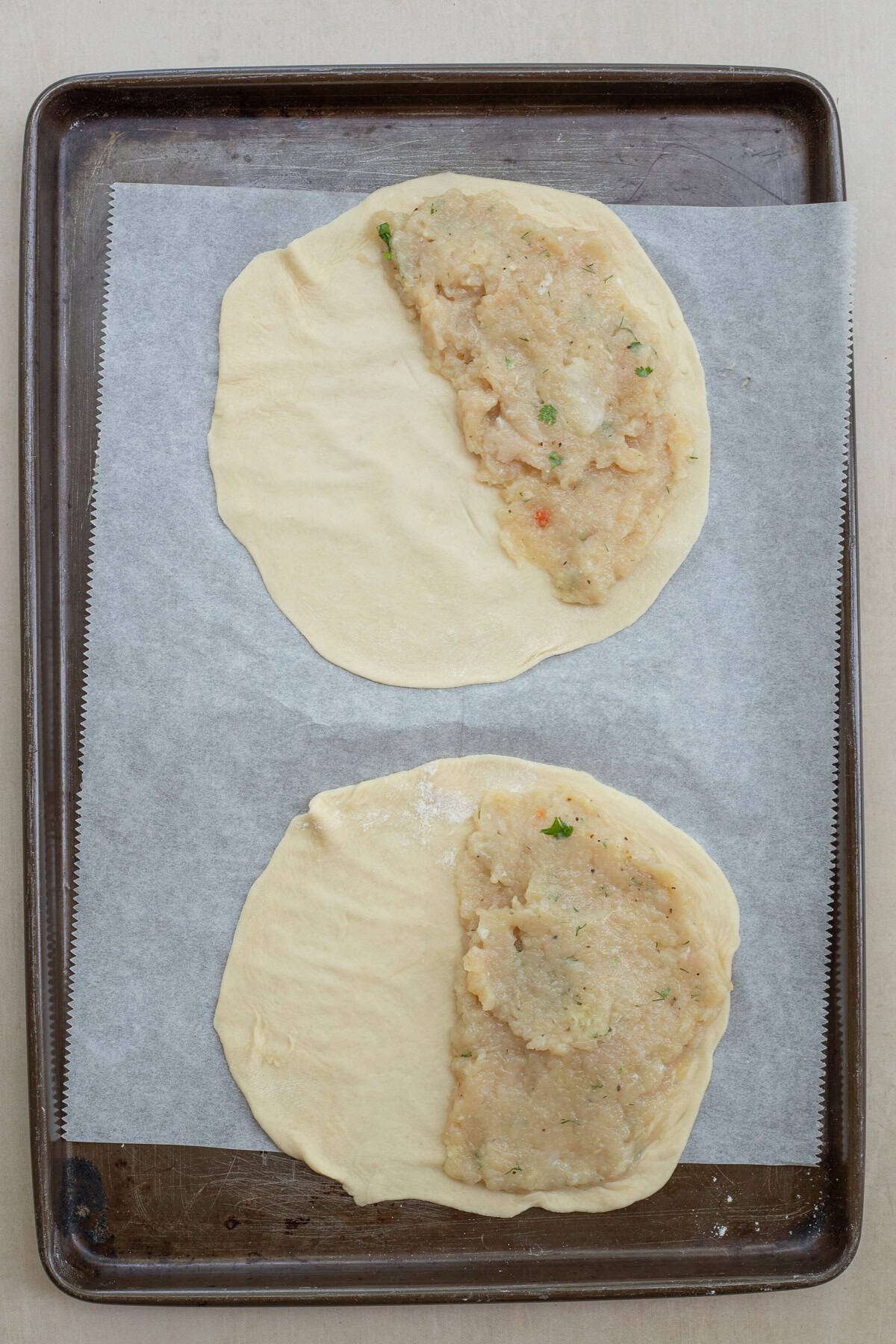 A simple chicken chebureki recipe made from scratch. Tortilla dough with meat on one side.
