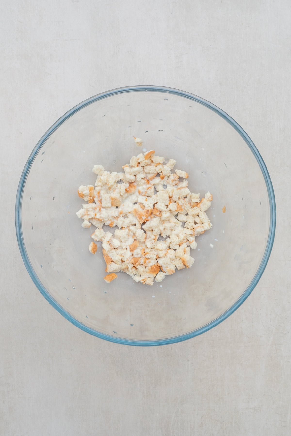 Juicy Chicken Patties Recipe for Dinner A glass bowl with bread and milk.