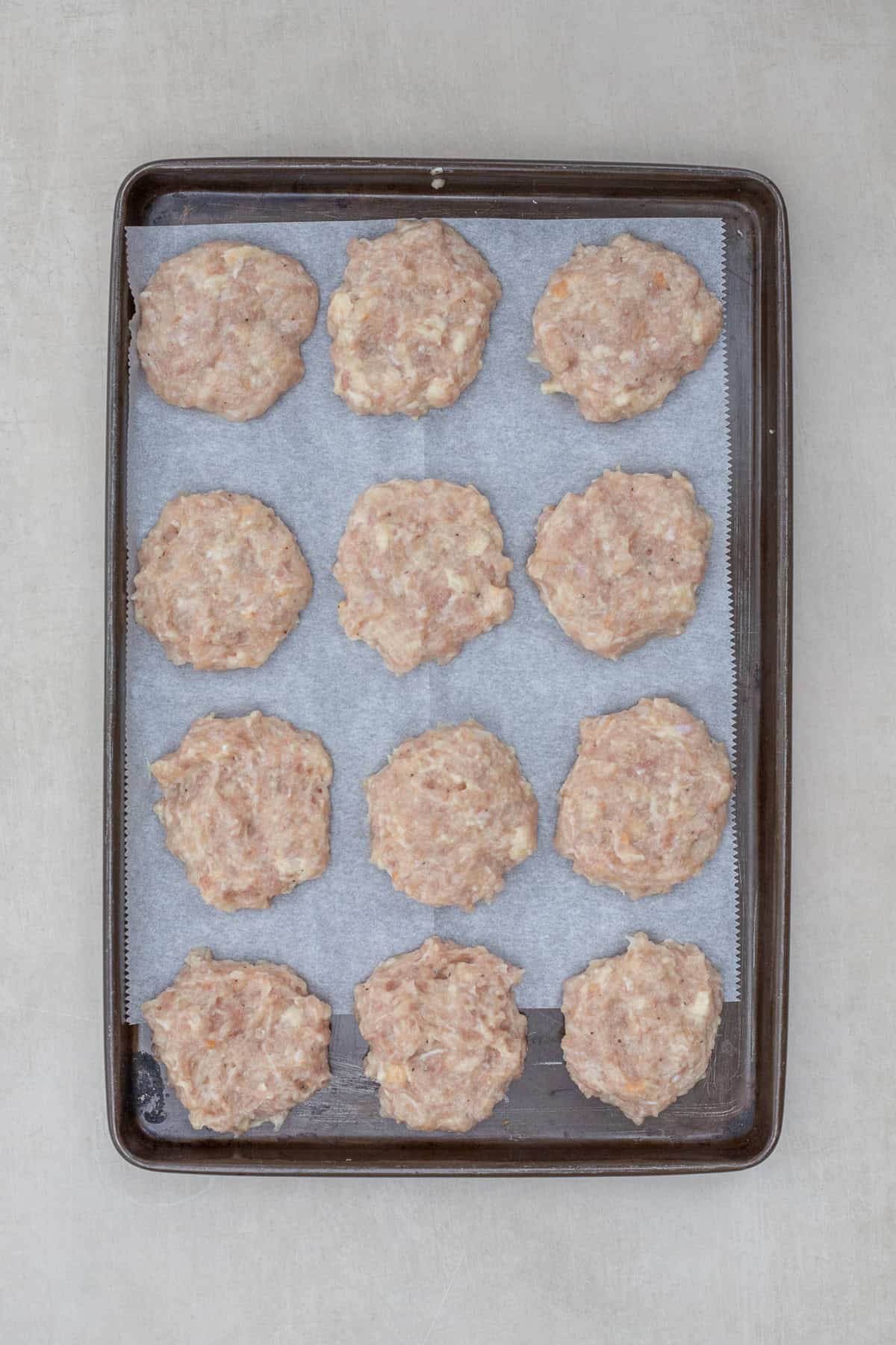 Chicken Patties Recipe (Fast & Family-Friendly) A sheet pan with the formed chicken patties.