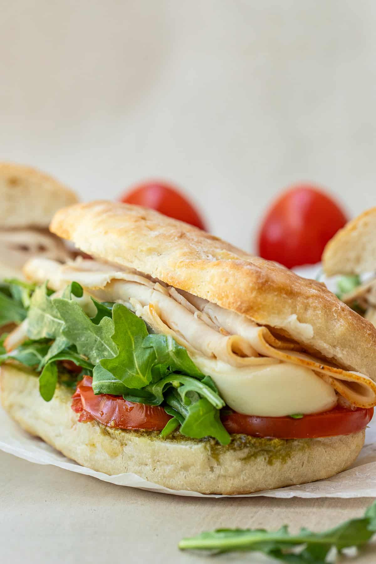 An Easy Chicken Pesto Sandwich Recipe A pesto chicken sandwich in a ciabatta bread loaf.