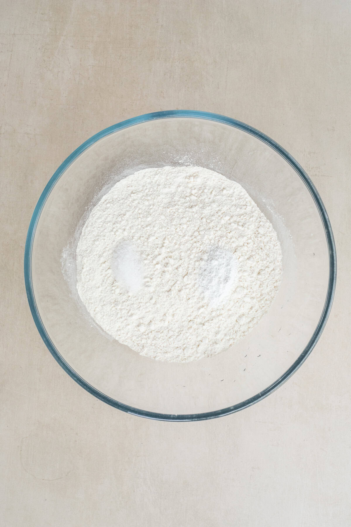 Easy Flour Tortilla Recipe Without Lard A glass bowl with the dry ingredients.