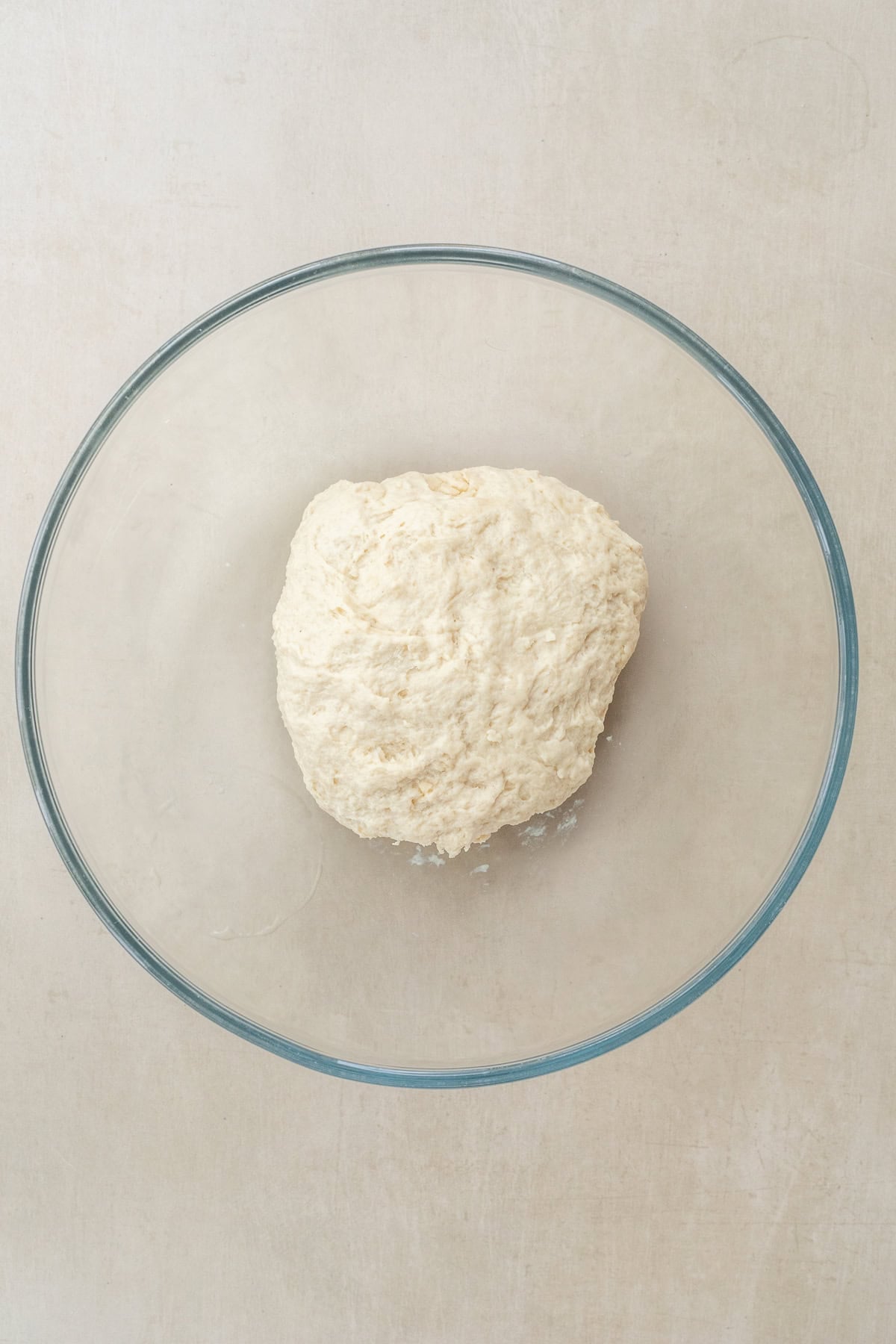 How to Make Flour Tortillas from Scratch A glass bowl with the mixed dough.