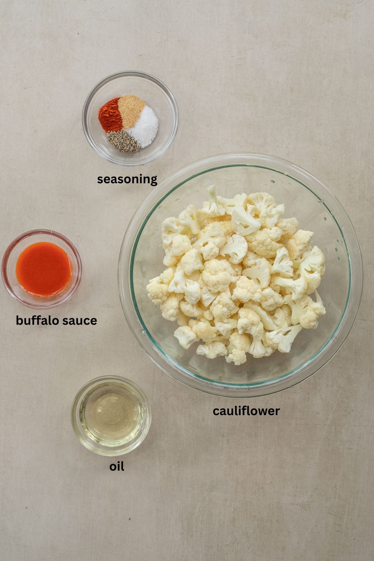 Crispy Air Fryer Cauliflower Recipe (Ready in 20 Minutes) All of the ingredients for air fryer cauliflower labeled.