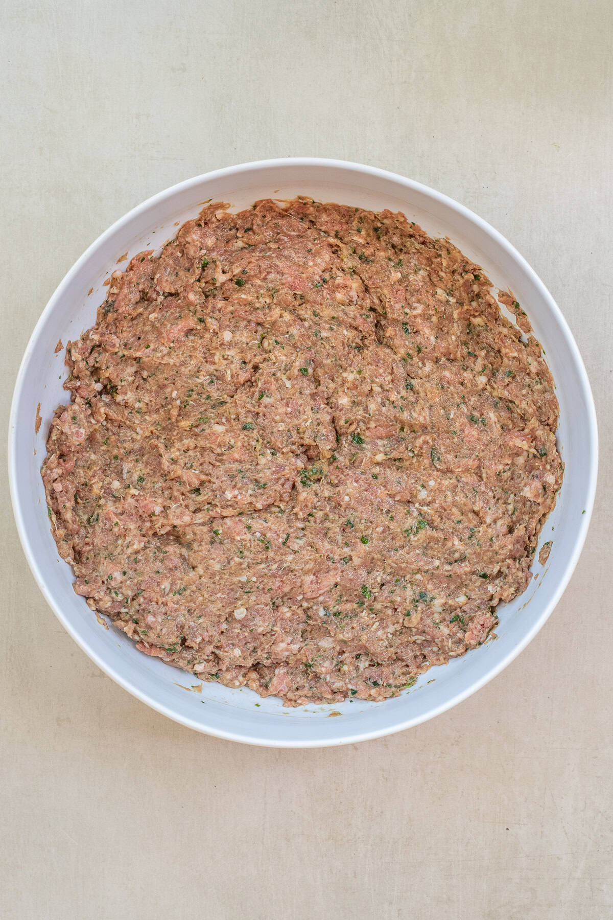 Grilled Ground Lamb Kebabs That Are Juicy and Flavorful A large bowl with the mixed lamb kebab mixture.