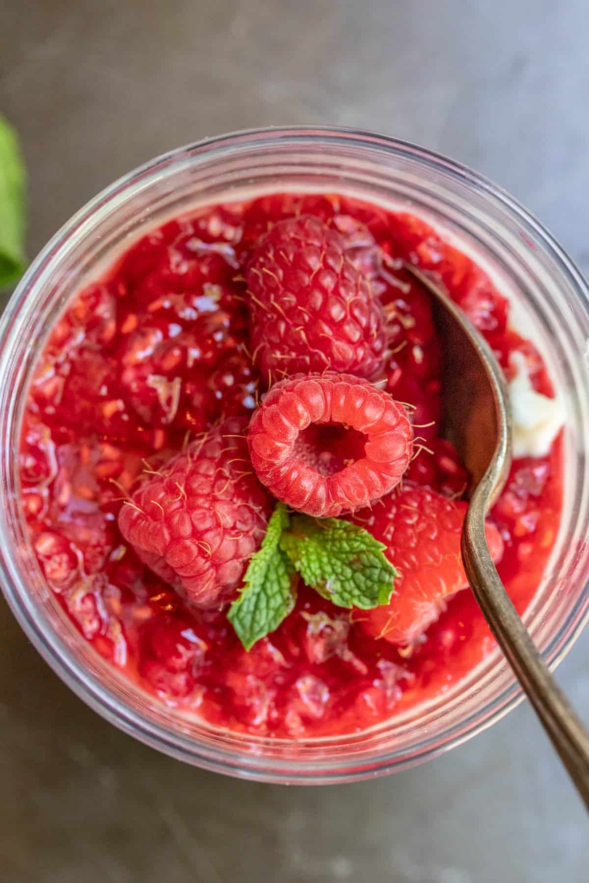 Creamy Homemade Panna Cotta Panna cotta topped with a homemade raspberry sauce.