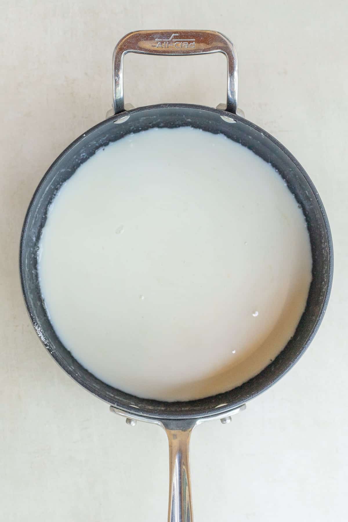 Homemade Vanilla Panna Cotta A pan with the liquid panna cotta mixture.
