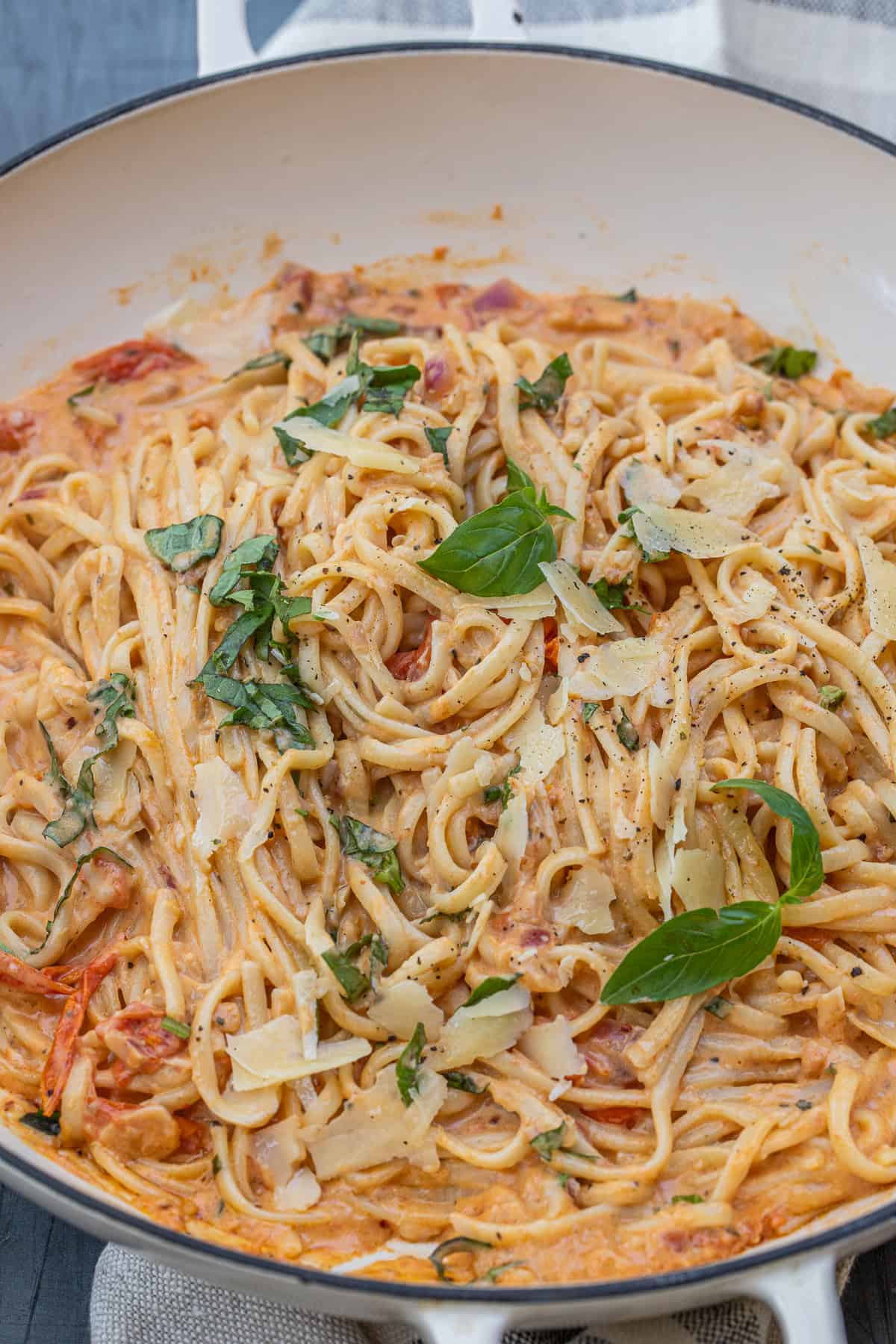 Easy Boursin Pasta Recipe for a Quick Weeknight Meal A pot of creamy tomato pasta garnished with basil.