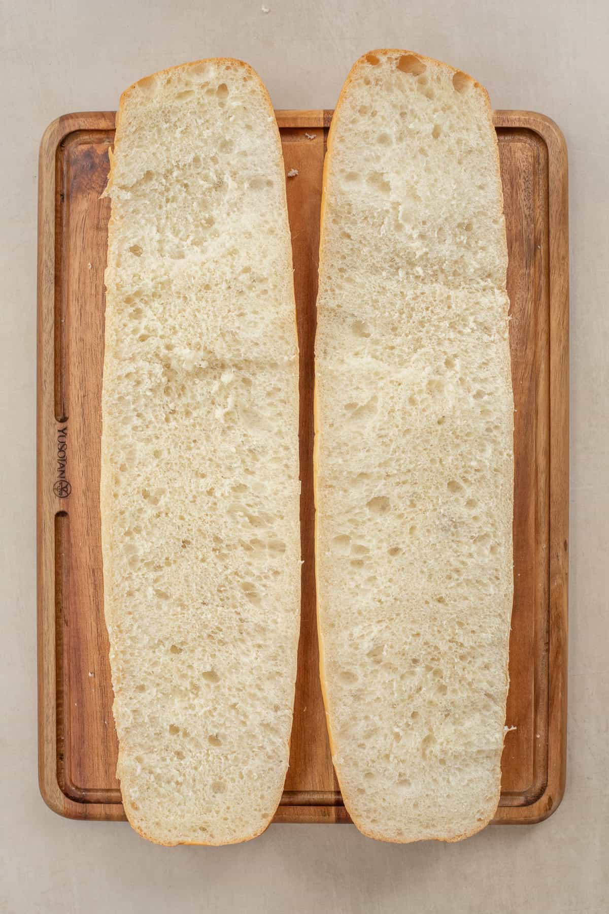 Homemade Garlic Cheesy Bread Recipe The sliced french loaf for cheesy bread.