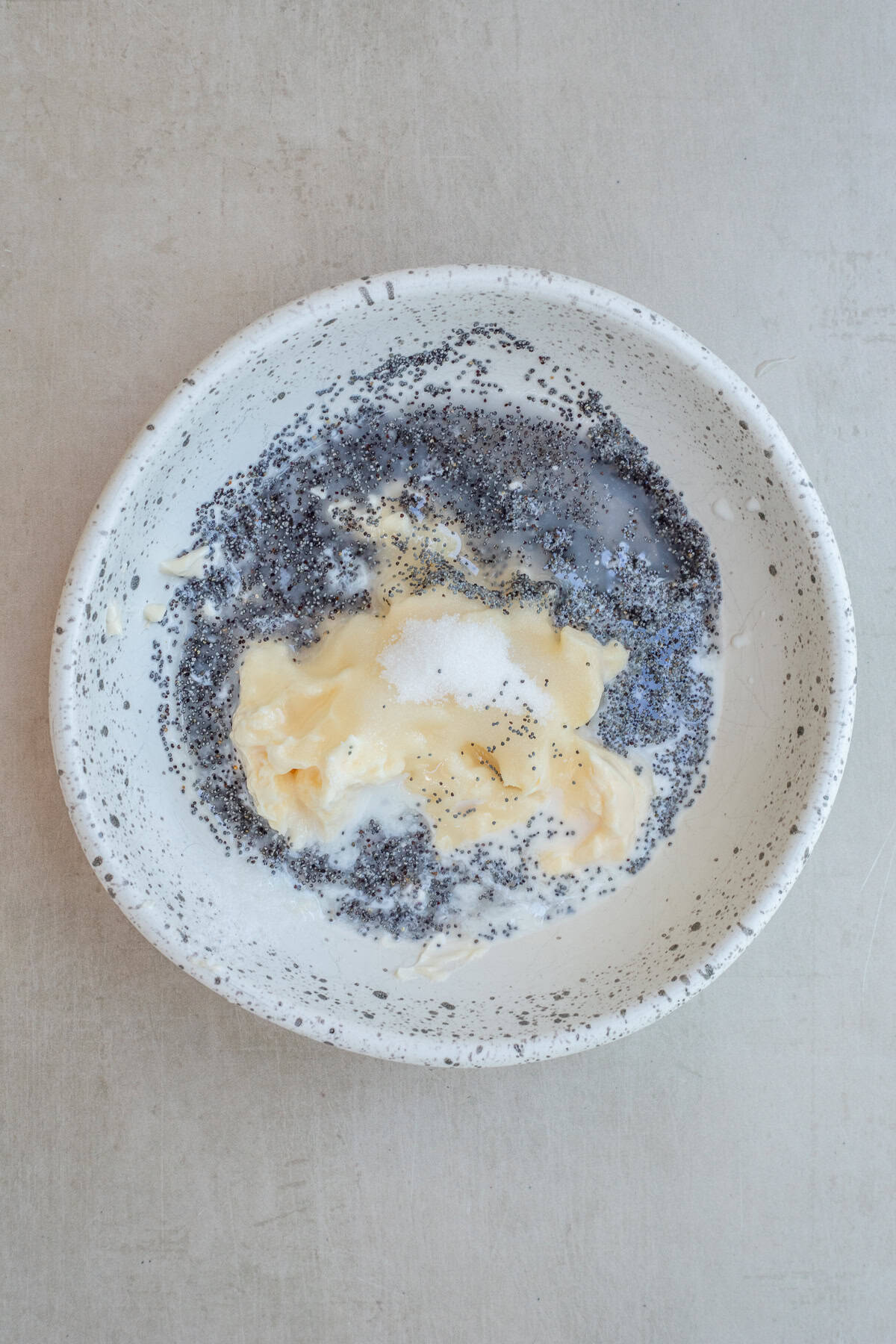Simple Creamy Poppy Seed Dressing from Scratch A bowl with the poppy seed dressing ingredients.