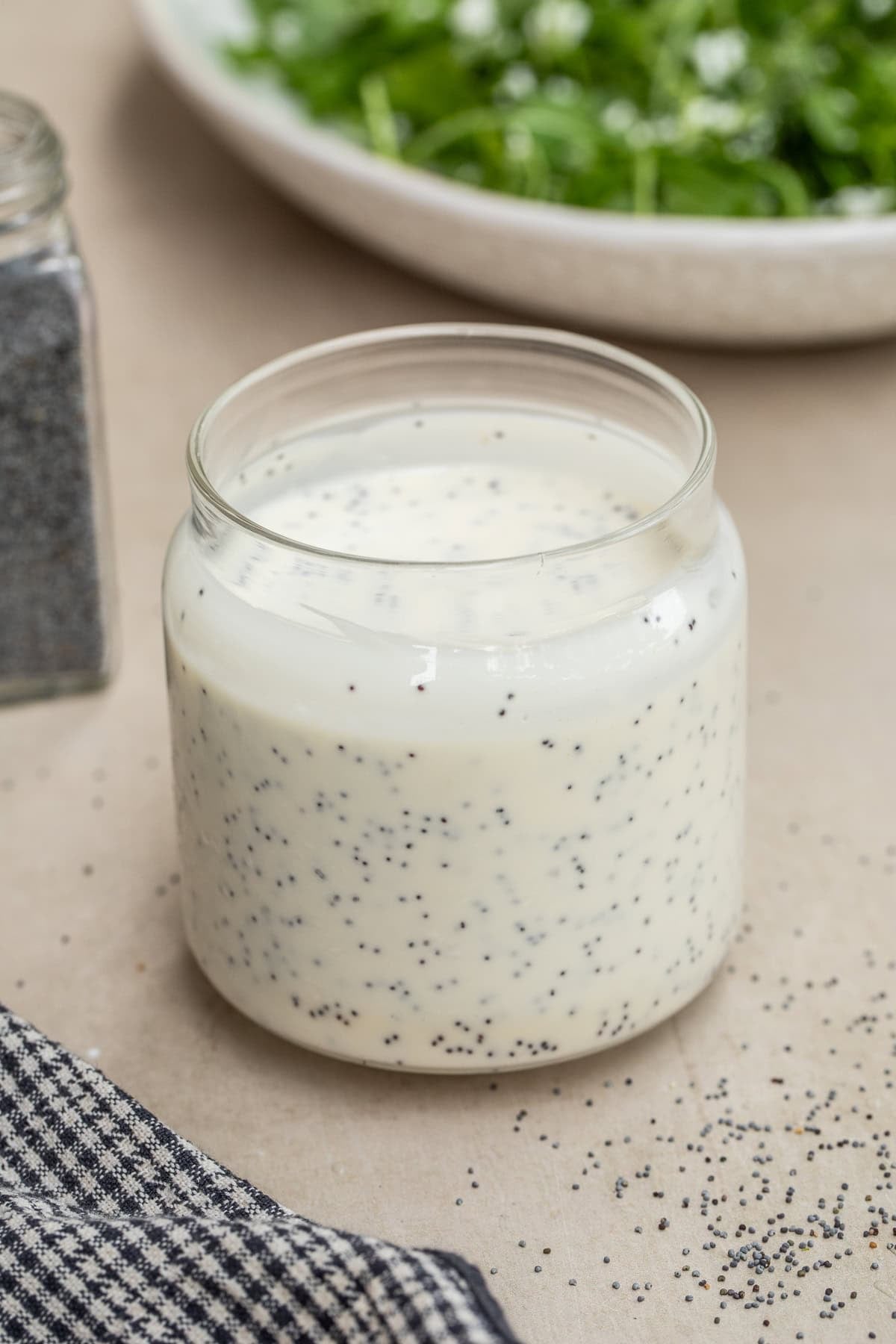 Creamy Poppy Seed Dressing Made With A Mayo Base A mason jar filled with homemade creamy poppy seed dressing.