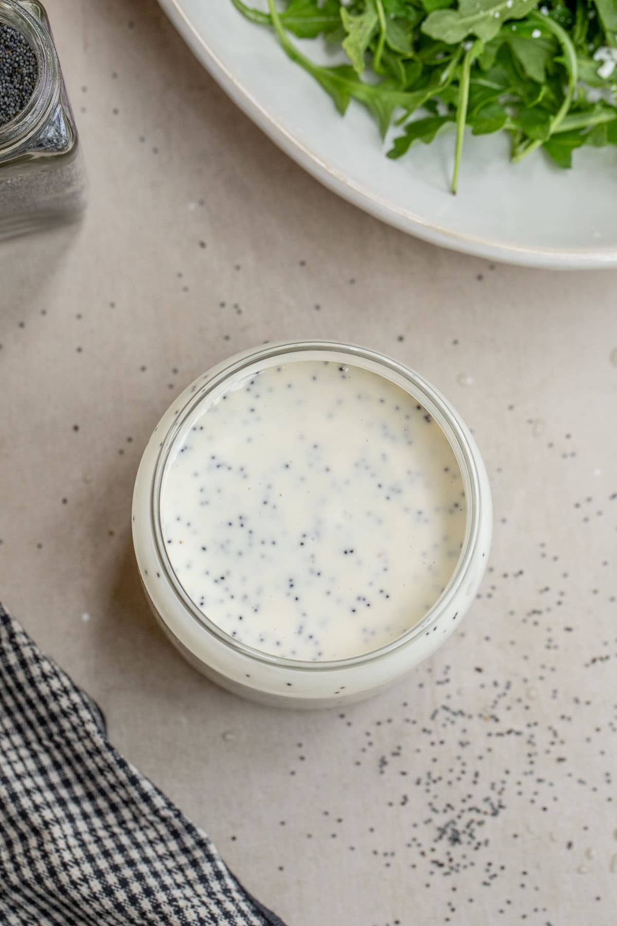 Creamy Poppy Seed Dressing Perfect For Salads A jar of homemade creamy poppy seed dressing.