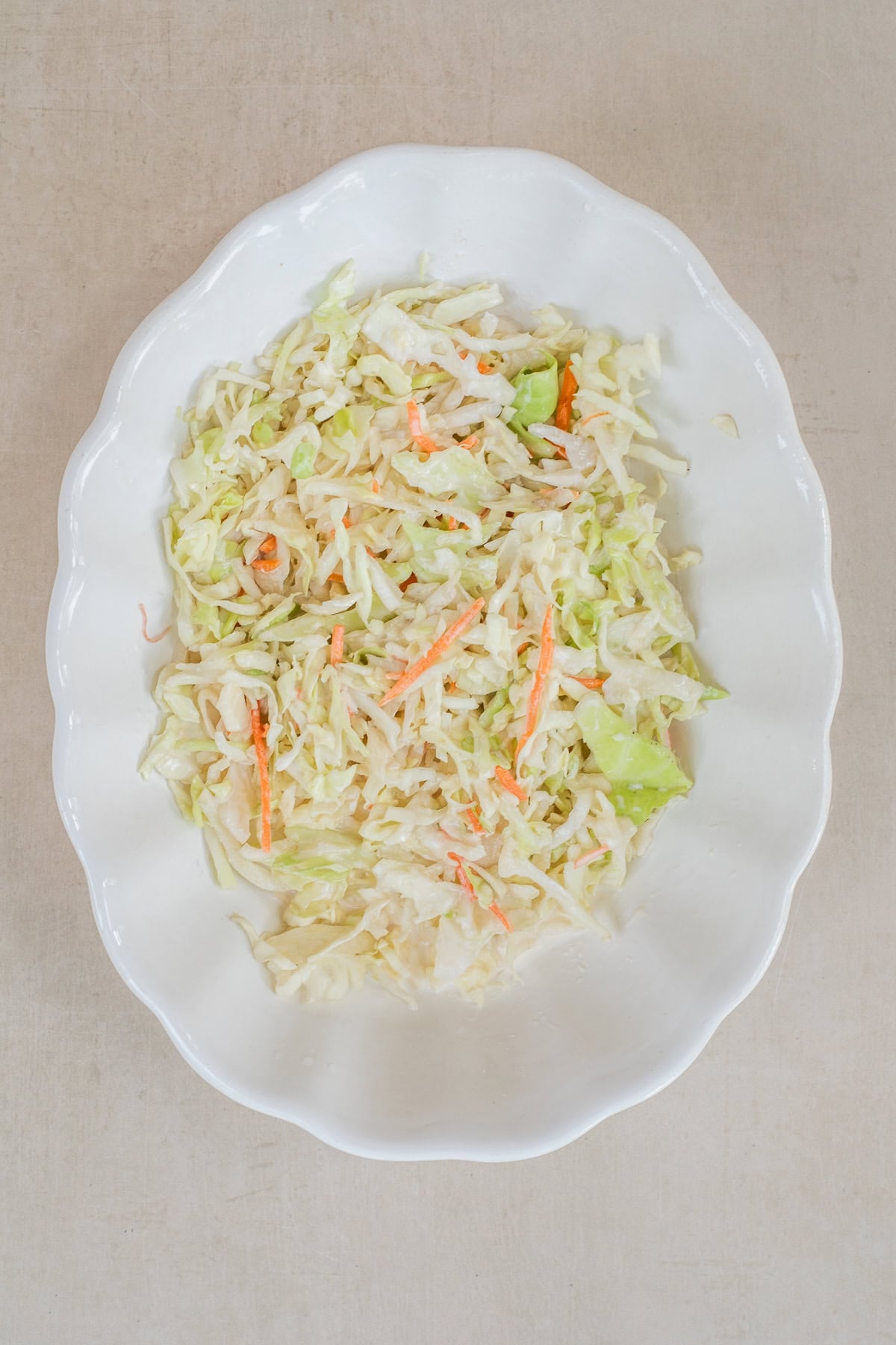 Homemade Hot Honey Chicken Sandwich Topped With Crisp Coleslaw A bowl of coleslaw mix.