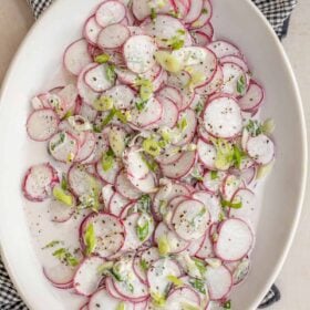 A large salad bowl with the creamy radish salad.