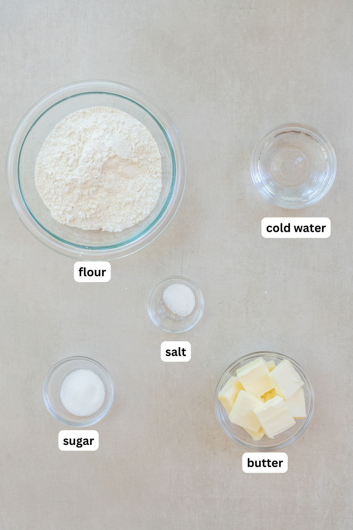 The best galette dough recipe for creating rustic fruit galettes and savory pastry dishes. All of the ingredients for galette dough labeled.